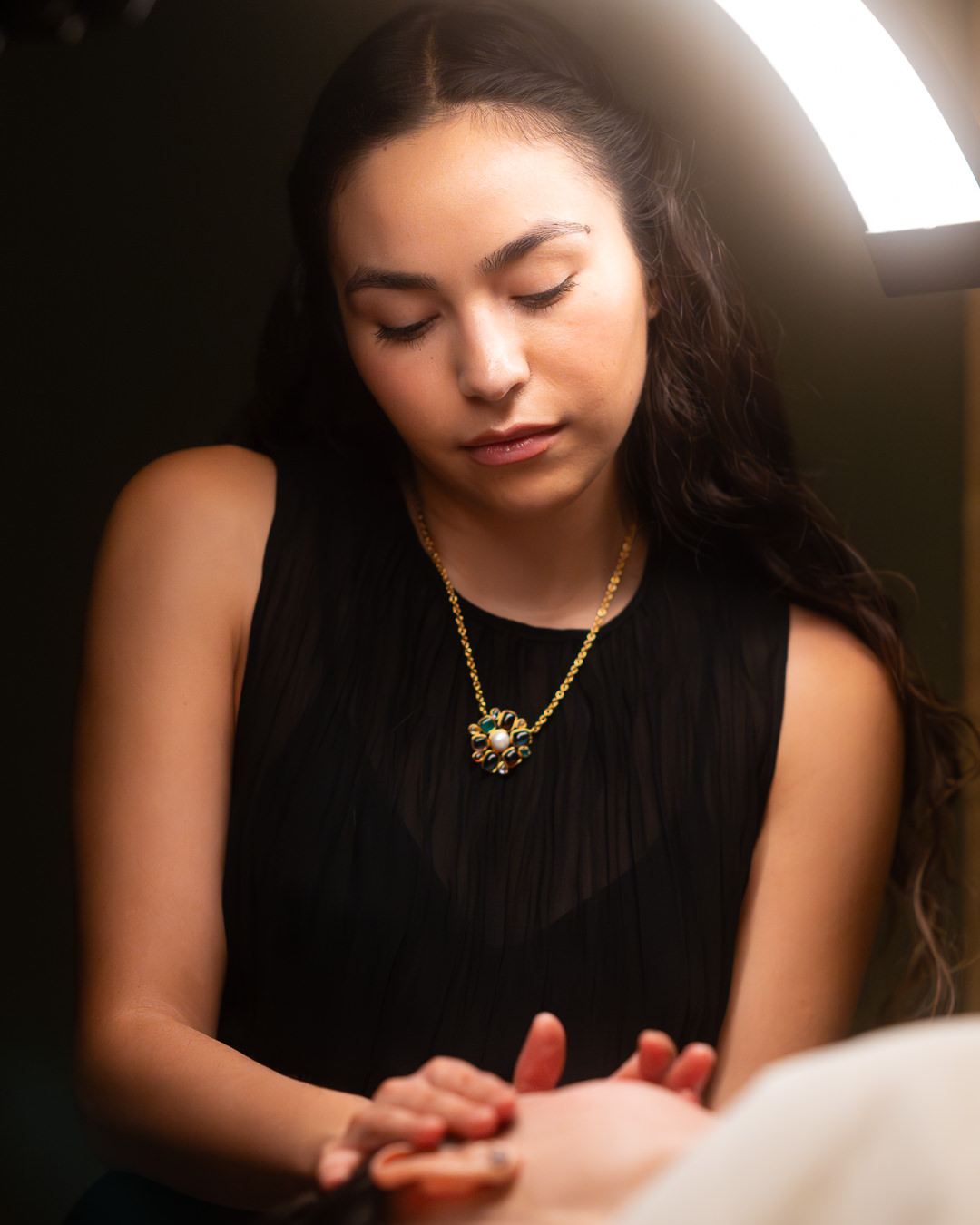 Nyah performing a facial
